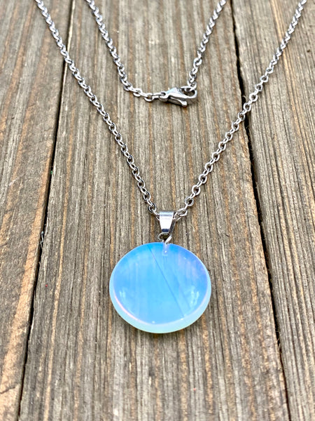 An Eye catching synthetic Opal stone round shape Pendant Necklace with High Quality No Fade Non Tarnish Hypoallergenic Stainless Steel chain