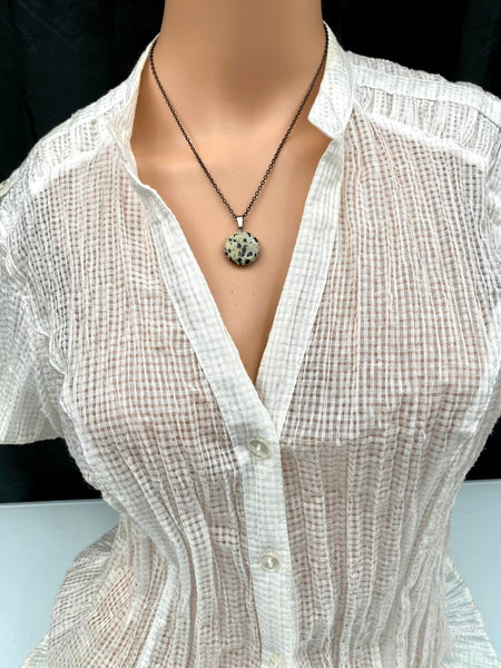 An Eye catching Dalmatian stone round shape Pendant Necklace with High Quality No Fade No Tarnish Hypoallergenic Black Stainless Steel chain