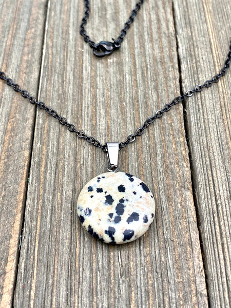 An Eye catching Dalmatian stone round shape Pendant Necklace with High Quality No Fade No Tarnish Hypoallergenic Black Stainless Steel chain