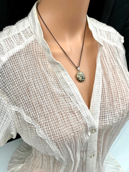 An Eye catching Dalmatian stone round shape Pendant Necklace with High Quality No Fade No Tarnish Hypoallergenic Black Stainless Steel chain